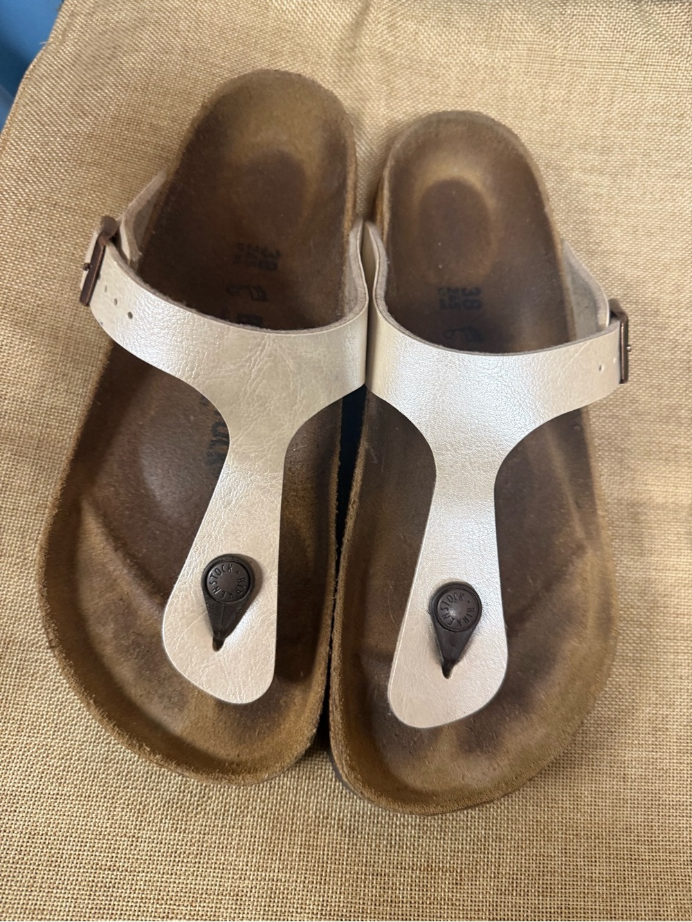 Birkenstock White T-Strap Sandals with Black Plug Accent